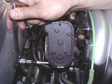 the intake manifold. One hose is low on the drivers side rear of the manifold (See picture 27).