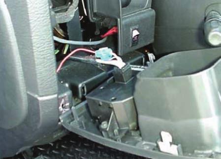 The light dimmer switch is easy to access as the cover and switch assembly are held in place with expansion clips. Start at the corner next to the steering column, then pull outward. (FIG.