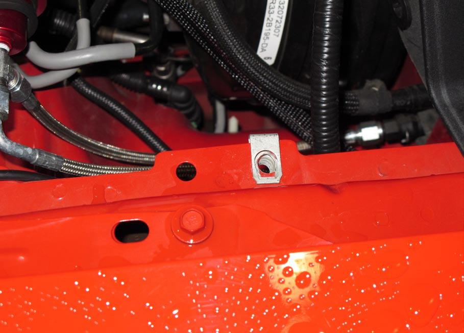 located under hood. (See Fig 1-a) B.