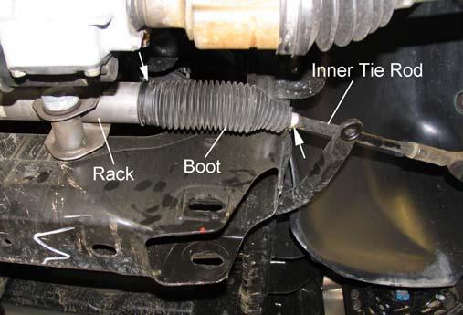 Slide boot to expose rack and inner tie rod. Illus. 6 2) Support the lower control arm with a jack.