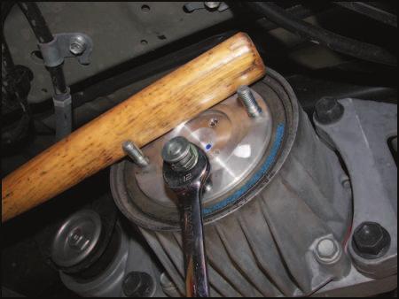 HINT Use a wooden or plastic hammer/mallet handle to protect the stud threads and hold the coupling when loosening the stud bolts.