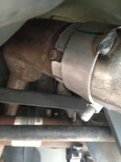 16. Now that your muffler is in place, go back to the clamp on the over axle-pipe and loosen it a little to allow you to move and adjust it on the over-axle pipe.