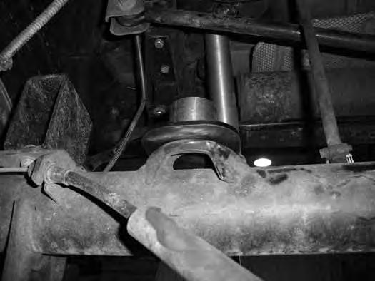 Note the areas to be welded on each side of the mount to the axle and at the front where the new mount rests on the factory one. FIGURE 22R FIGURE 23R 42.
