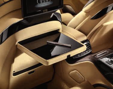 Audi exclusive fold away table manually operated, with real wood inlay. On the backrests of the driver and/or front-passenger seats.