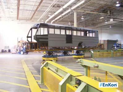 (V0633) A lift system is integrated into a bus assembly system, raising the
