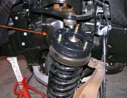 Loosen the lower strut bolt and nut and push the upper control arm up