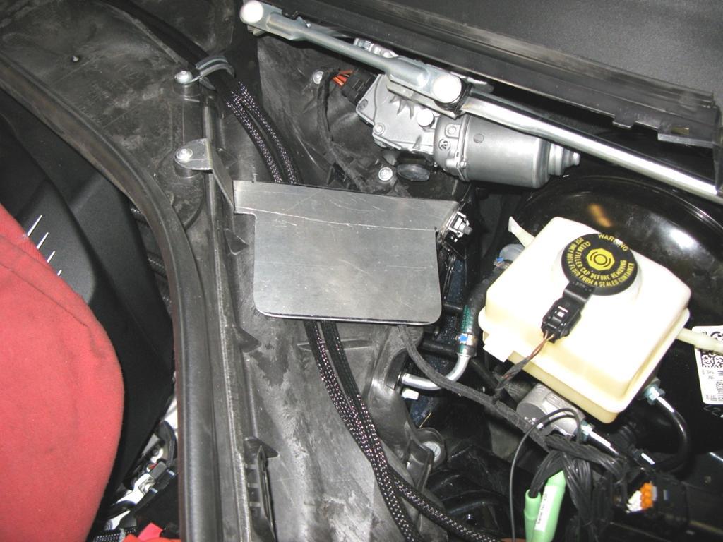 30. Install the DINANTronics box bracket using the wiper motor screw and the screw in
