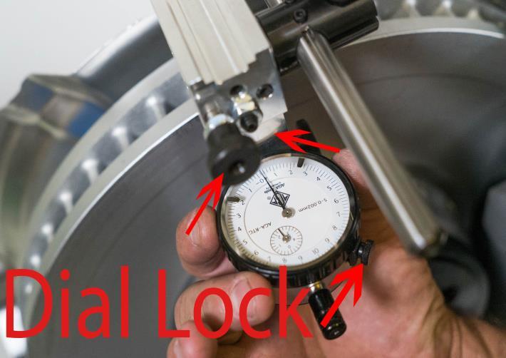 A11. Loosen dial lock knob. Rotate dial face until the needle is pointed to 0. Gauge is now 0 out. Slightly tighten dial lock.