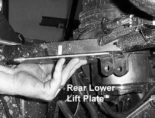 9. Locate one lower lift bracket and one