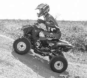 Never climb hills with excessively slippery or loose surfaces. Shift your body forward. Never open the throttle suddenly. The ATV could flip over backwards.