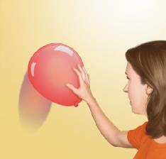 What will happen when a balloon you have rubbed against your hair is held against
