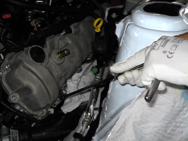 14. (Optional) Place a rag over the exhaust manifold/headers to