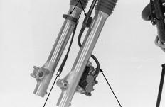 m, 17 ft-lb) Tighten the fork top pinch bolts to the specified torque. TORQUE: 21 N.m (2.1 kg.