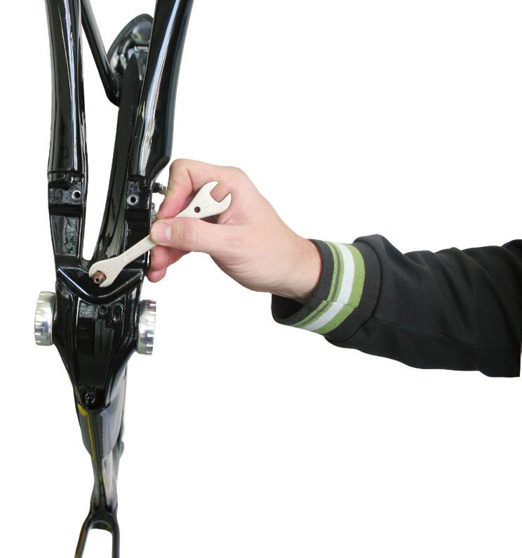 Adjust (shorten) the inline cable adjuster as required to move the pads away from the rim and give the desired