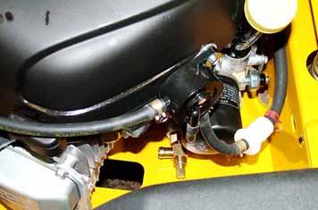 IMPORTANT: All oil drips or spills must be cleaned off of the exhaust system before operating the machine. 9. Re-install the dust cap on the oil drain valve nipple. 10.