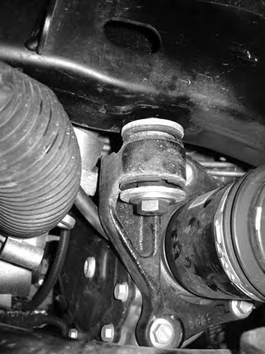 23. Support the differential with a hydraulic jack (transmission jack preferred). Remove the remaining two front mounting bolts and lower the differential from the vehicle.
