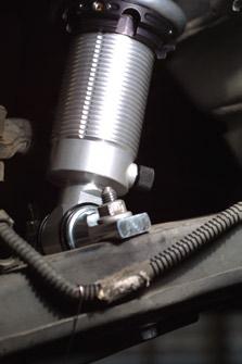 Use the 1/2-20x2-1/2 hex bolts and locknuts supplied with your kit to attach the upper shock eye to the mount. See photo below.
