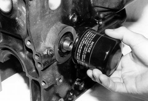 b. INSTALLATION OF OIL FILTER Inject a small amount of engine oil into the cartridge. Apply engine oil to the O-ring of the cartridge. Fig.