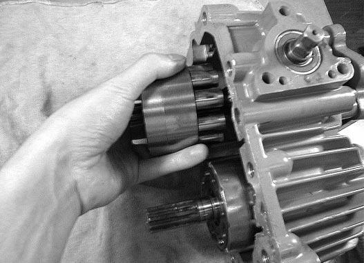 5-11 (2) Remove the cylinder block assembly (pump side). Fig. 5-9 b.