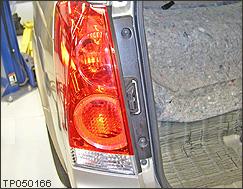 a. Remove the two taillight bolts shown in Figure 19.
