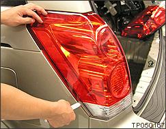 Use a plastic pry tool to snap loose the taillight