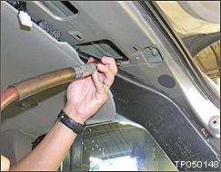 10. Blow shop air into the body panels (upper corners) from inside the vehicle as shown. NOTE: An air nozzle with a long tip is helpful for this step.