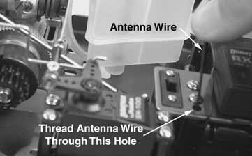 Thread the receiver antenna through the antenna tube. The antenna will be longer than the antenna tube.