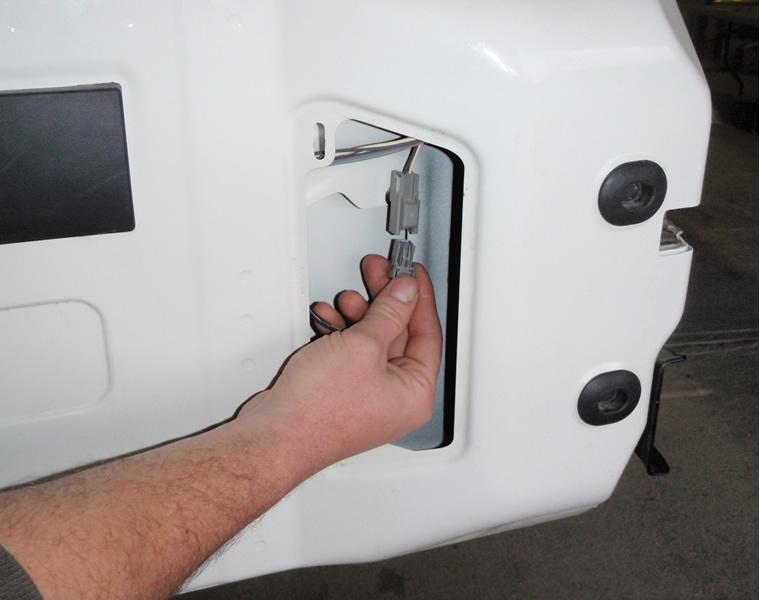 (page 14). 2. Remove the vent bezel on the inside of the tailgate to access the connector for the CHMSL (Center High Mount Stop Lamp).