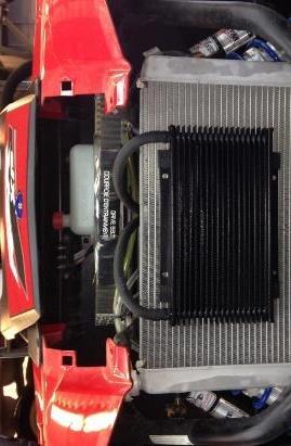 OIL COOLER ASSEMBLY RZR SUPERCHARGER KIT Locate the Oil Cooler Kit as shown.