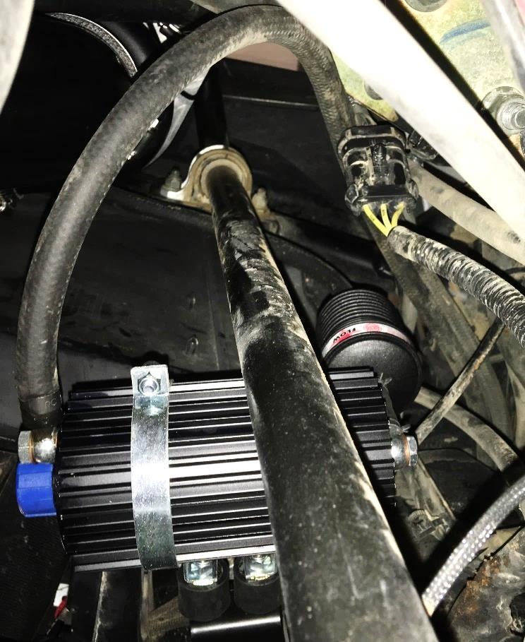 Attach Oil Lines. The Oil Line that goes to the TOP Fitting leads to the Oil Cooler.
