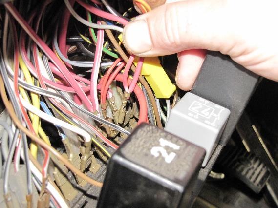 Disconnect and remove relay from under driver seat 2. Connect the red/black wire to the vertical spade of the isolator 3. All other wires will be abandon. A. Make sure to insulate abandoned connectors with tape.