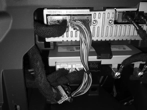 Fig. 3 Connect the remaining amplifier harness connector to the radio. Make sure the connector is fully seated. Fig.