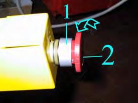 Loosen the metal ring #1 and turn the red button #2 (Fig.108) counter clockwise for a quarter of a turn pull it up to take it off.
