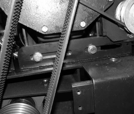 Tensioning or Replacing the Hydraulic Motor Belt Figure 20: 2 of 4 Engine Adjustment Screws 3.