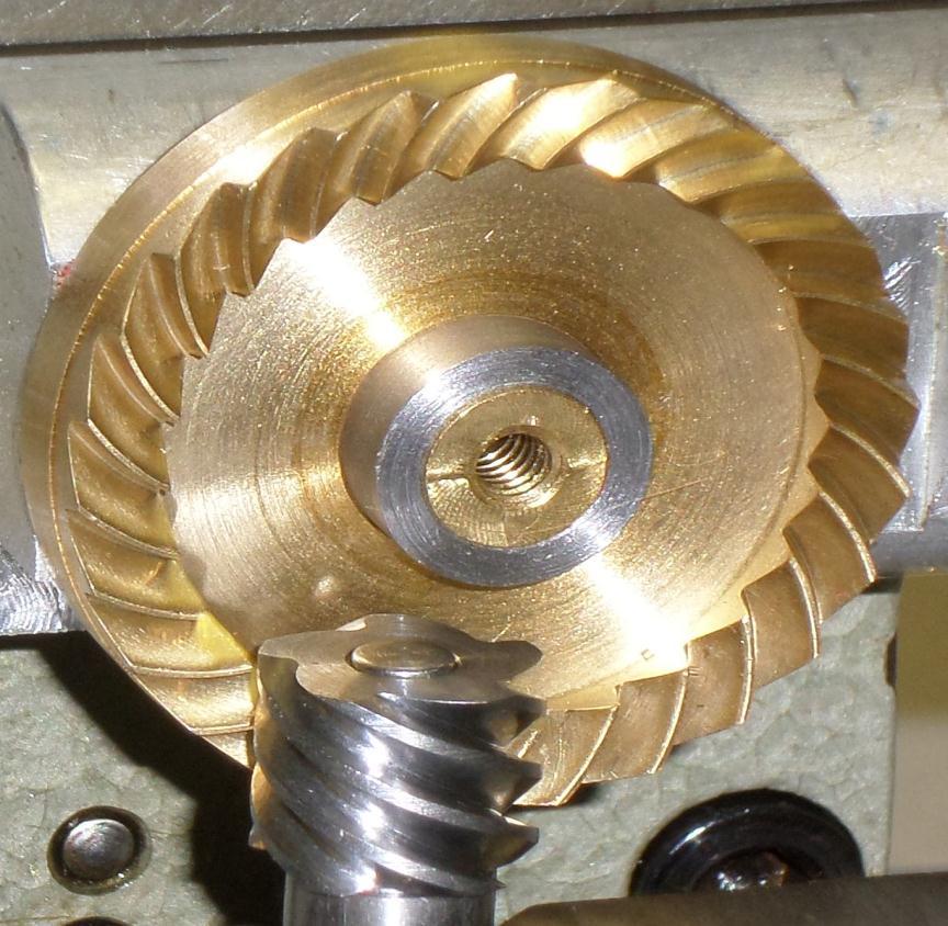 SPIRAL FACE GEARS A spiral face gear can be engaged with an involute helical pinion or worm at intersecting or crossed axes. Such engagement is used in the Helicon type gears [3].