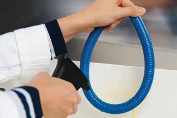 ABB food & beverage cable protection solutions 5 01 02 03 04 01 Spraying a solution of Riboflavin over a length of the conduit.