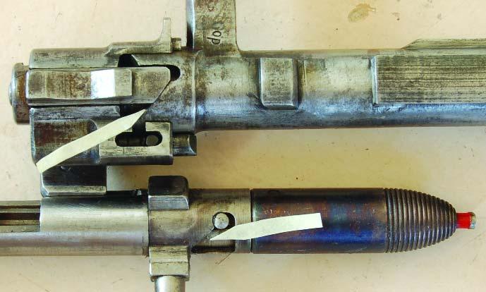 In both guns a friction piece rubs on the outside of the magazine tube to slow the rearward motion of the recoiling barrel.