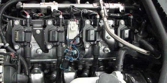 35. Use a 10mm socket to remove the five bolts retaining the coil bracket on each valve cover
