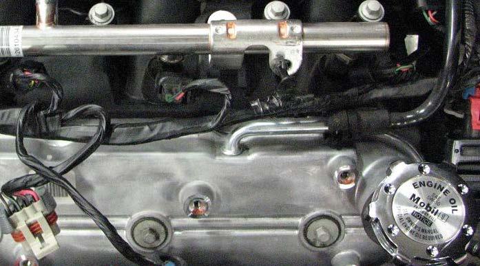 NOTE: You will also need to remove one 8mm manifold bolt and bracket before removing the fuel