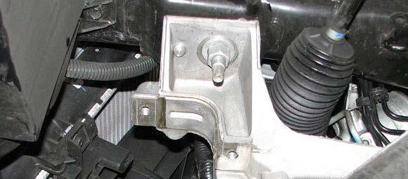 Loosen the rear engine cradle nuts with a 21mm deep socket and lower them until there is a