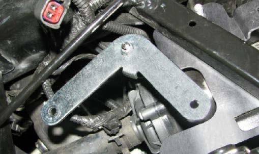 Use a 10mm socket to loosely install the water pump bracket using the stock horn bracket bolt on top and the bolt