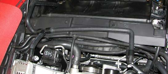 Install the short molded hose from the outlet of the intercooler water pump to the heat