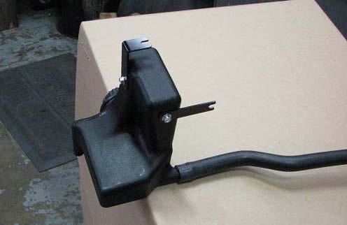 Use a 10mm socket to loosen rear hood hold down latch bolt on passenger side fender. 171.