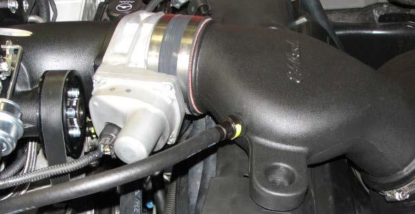 Route the supplied MAF wire harness near the driver side of the throttle body. 220.