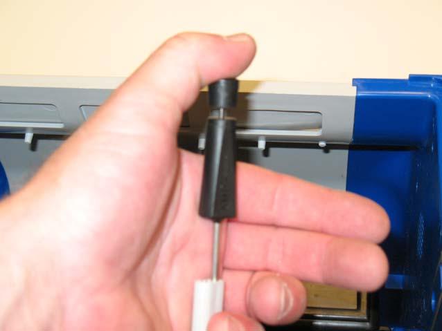 Carefully insert pin removal tool into power cord connector.
