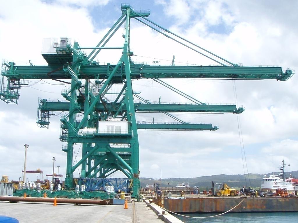 Figure 3. Modified Hitachi Cranes at Guam Drive Upgrade 2009. A terminal operator operates four dockside container cranes: two built in 1980 and two built in 1994.