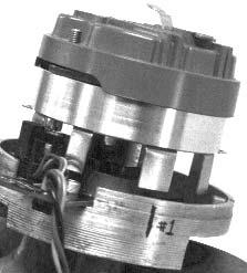 On large cap distributors, diamond-shaped shims are provided to allow for adjusting shutter wheel height. 13. Install the drive gear, shims, and roll pin to the bottom of the distributor shaft.