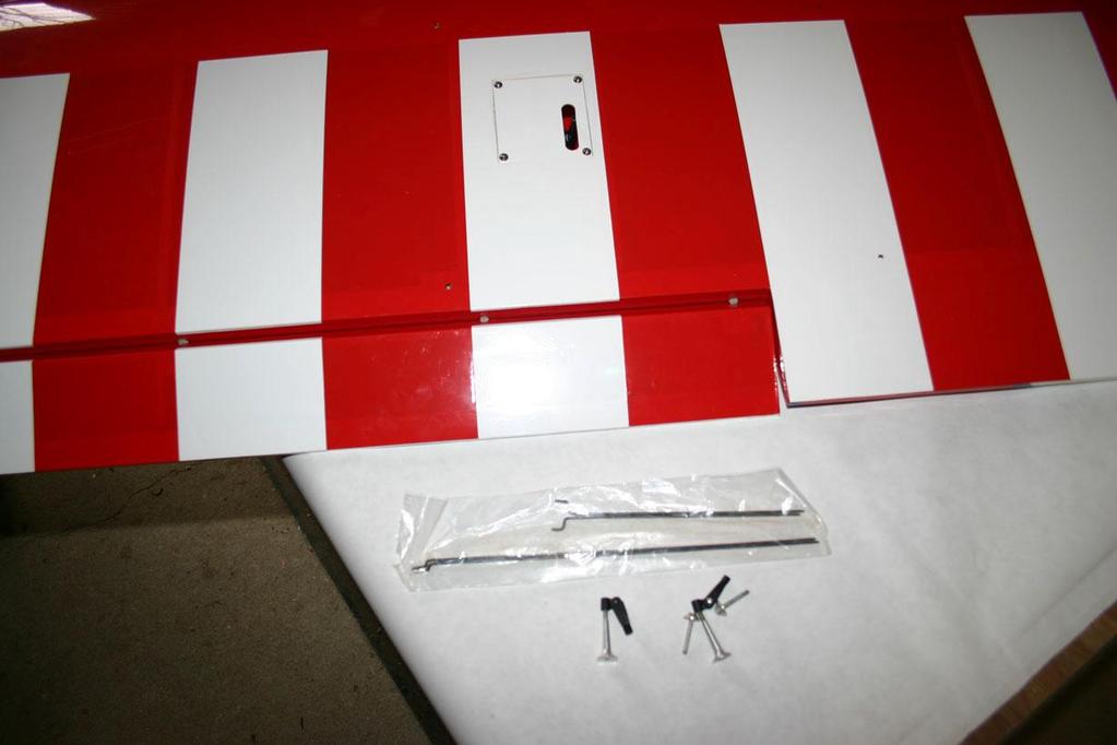 Secure the servo and hatch assembly to the wing using the supplied hardware, 4 x wood screws.