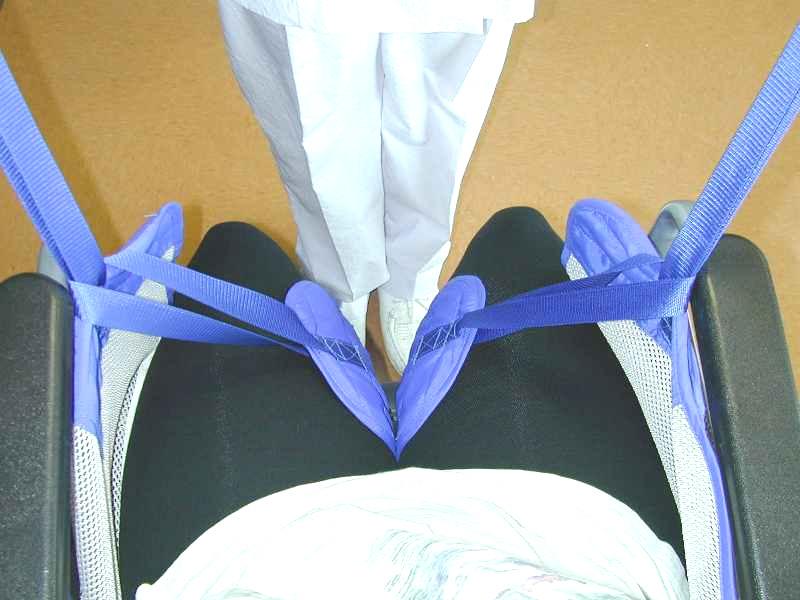 a) Thread the long strap through the short strap on each leg.