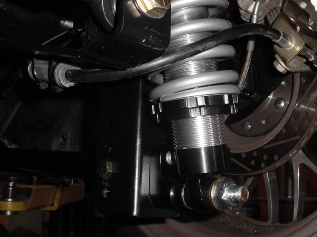 For coil over adjustment, use the threaded nuts on the shock only to fine tune the ride height. The springs are only intended to hold the weight of the car.